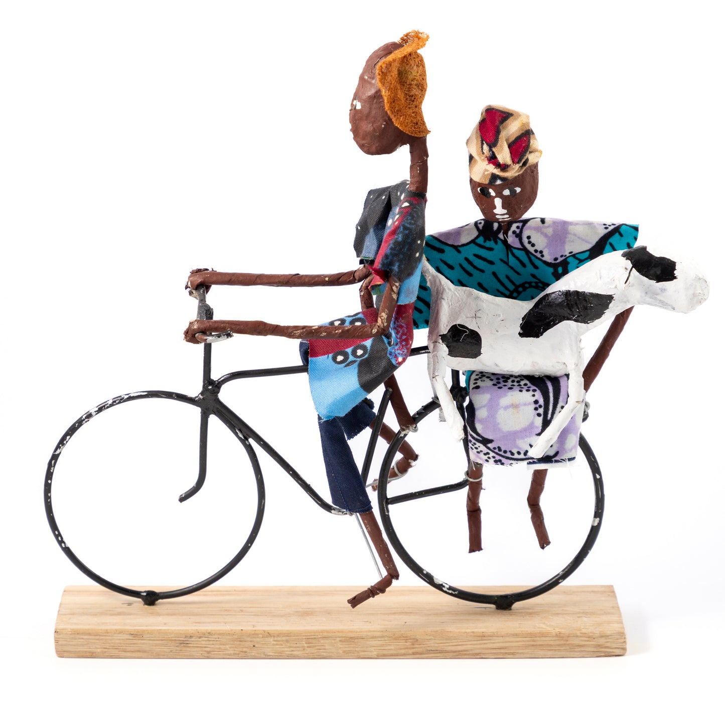Rustic African Bicycle Riders with Cow
