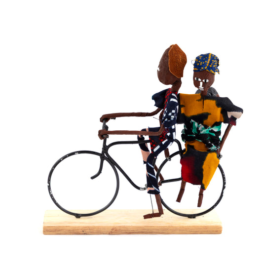 Rustic African Bicycle Rider With Mum & Baby